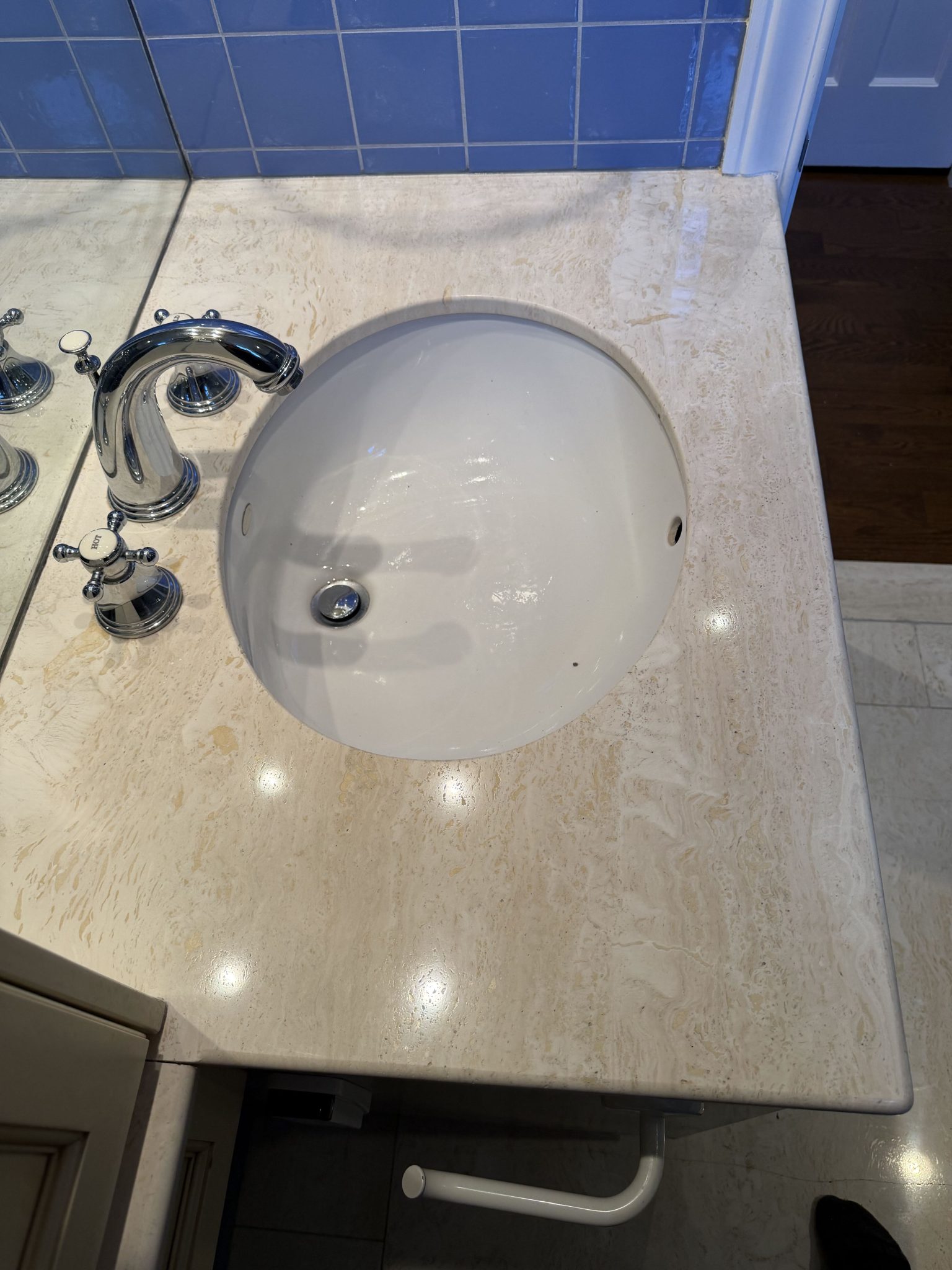 Restoring the shine of a travertine vanity — After polishing and sealing